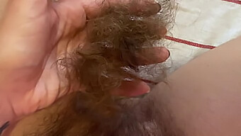 Closeup Of A Woman Shaving Her Long Pussy Hair At Home